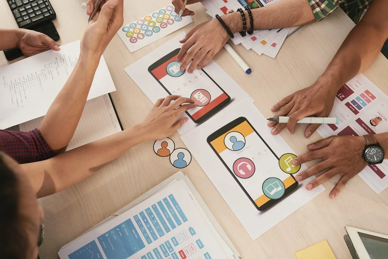 people, teamwork, business, document, meeting, coworker, start-up, hands, collaboration, application, discussing, information, idea, screen, table, lady, developing, technology, programmer, interface, icon, choosing, mobile, design, software